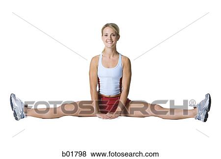 Portrait of a young woman exercising View Large Photo Image Stock Photo - Portrait of a young woman exercising. Fotosearch