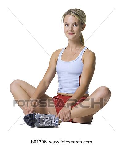 Portrait of a young woman exercising View Large Photo Image Stock Photograph - Portrait of a young woman exercising. Fotosearch