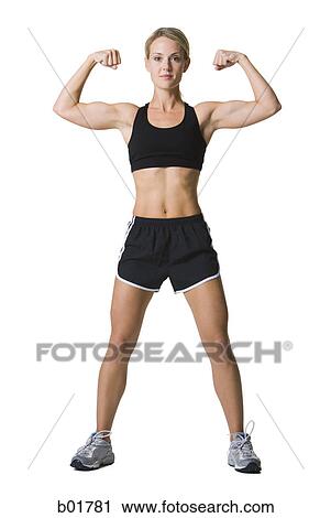 Portrait of a young woman flexing her muscles View Large Photo Image Stock Image - Portrait of a young woman flexing her muscles. Fotosearch