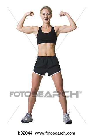 Portrait of a young woman flexing muscles View Large Photo Image Picture - Portrait of a young woman flexing muscles. Fotosearch