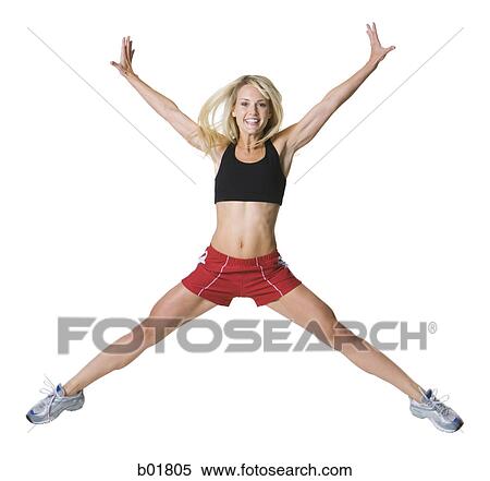 Portrait of a young woman jumping View Large Photo Image Stock Photography - Portrait of a young woman jumping. Fotosearch