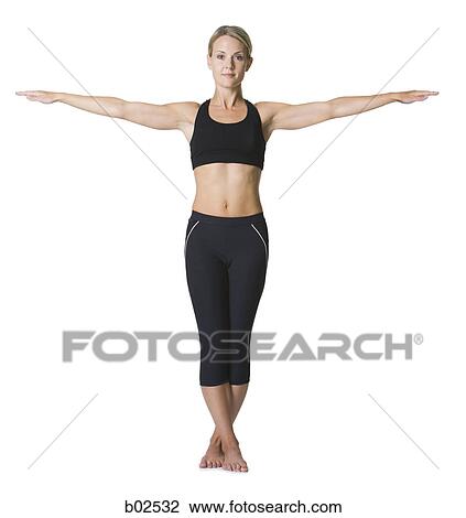 Portrait of a young woman standing with outstretched arms View Large Photo Image Stock Image - Portrait of a young woman standing with outstretched arms. Fotosearch