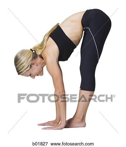 Stock Photo - Portrait of a young woman stretching. Fotosearch