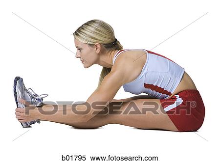 Profile of a young woman exercising View Large Photo Image Stock Photography - Profile of a young woman exercising. Fotosearch