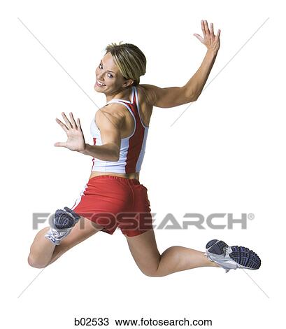 Rear view of a young woman exercising View Large Photo Image Stock Image - Rear view of a young woman exercising. Fotosearch
