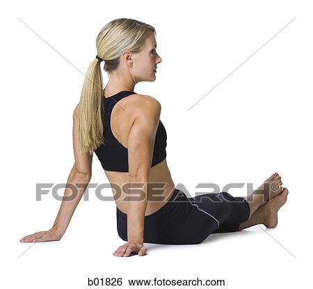 Stock Photograph - Young woman sitting on the floor. Fotosearch