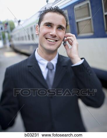 Close-up of a businessman talking on a cell phone View Large Photo Image Stock Image - Close-up of a businessman talking on a cell phone. Fotosearch