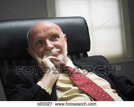 Close-up of a businessman with his head in his hands View Large Photo Image Stock Photo - Close-up of a businessman with his head in his hands. Fotosearch
