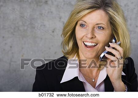 Close-up of a businesswoman talking on a mobile phone View Large Photo Image Stock Image - Close-up of a businesswoman talking on a mobile phone. Fotosearch