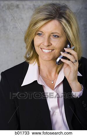Stock Image - Close-up of a businesswoman talking on a mobile phone. Fotosearch