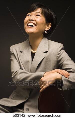 Stock Image - Close-up of a mid adult woman smiling. Fotosearch