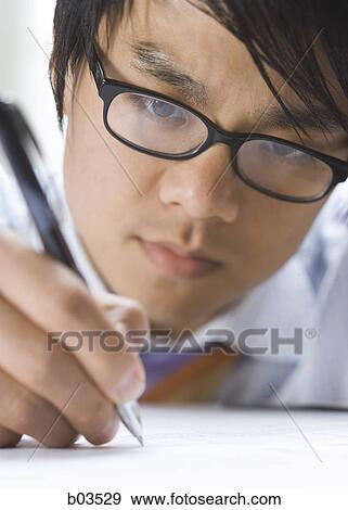 Portrait of a man holding a compact disc View Large Photo Image Stock Photo - Portrait of a man holding a compact disc. Fotosearch
