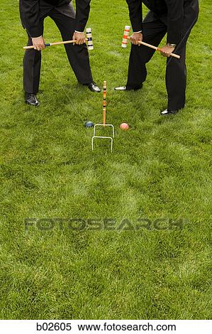High angle view of two businessmen playing croquet View Large Photo Image Stock Photography - High angle view of two businessmen playing croquet. Fotosearch