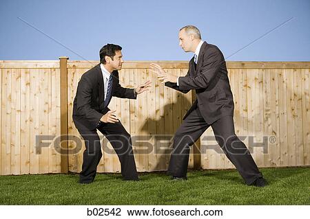 Profile of two businessmen playing and rough housing View Large Photo Image Stock Image - Profile of two businessmen playing and rough housing. Fotosearch