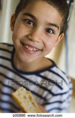Stock Photograph - Close-up of a boy smiling. Fotosearch
