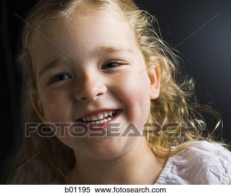 Close-up of a girl smiling View Large Photo Image Stock Photography - Close-up of a girl smiling. Fotosearch