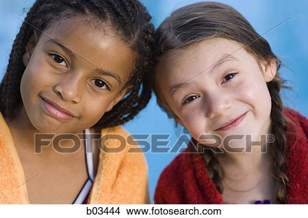 Close-up of a young couple holding a map and looking up View Large Photo Image Picture - Close-up of a young couple holding a map and looking up. Fotosearch