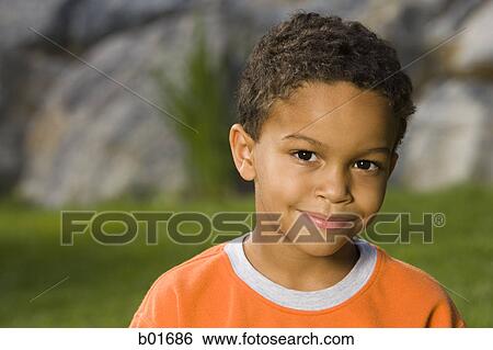 Stock Photograph - Portrait of a boy smiling. Fotosearch