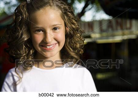 Stock Image - Portrait of a girl smiling. Fotosearch