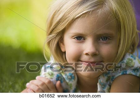 Stock Image - Portrait of a girl smiling. Fotosearch