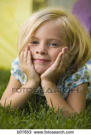 Stock Image - Portrait of a girl smiling. Fotosearch