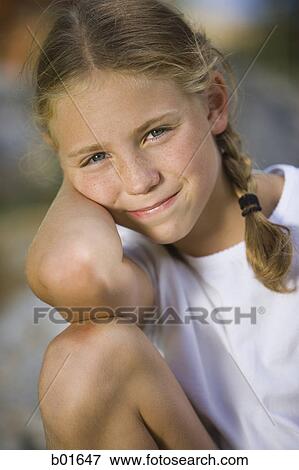 Stock Photo - Portrait of a girl smiling. Fotosearch