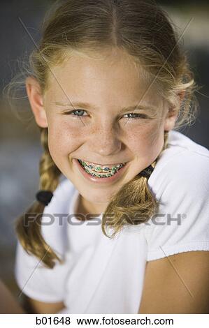 Portrait of a girl smiling View Large Photo Image Stock Photo - Portrait of a girl smiling. Fotosearch
