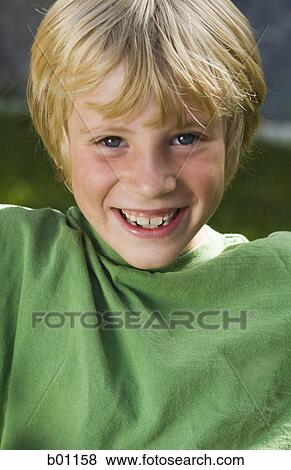 Portrait of a teenage boy smiling View Large Photo Image Stock Photo - Portrait of a teenage boy smiling. Fotosearch