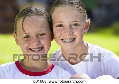Portrait of two girls smiling View Large Photo Image Stock Photo - Portrait of two girls smiling. Fotosearch