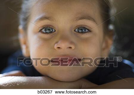Young girl looks at the camera. View Large Photo Image Stock Photo - Young girl looks at the camera.. Fotosearch