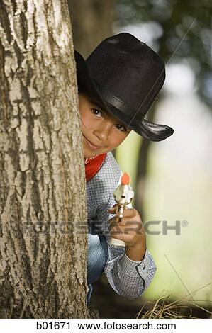 Stock Image - Portrait of a boy in a cowboy costume. Fotosearch