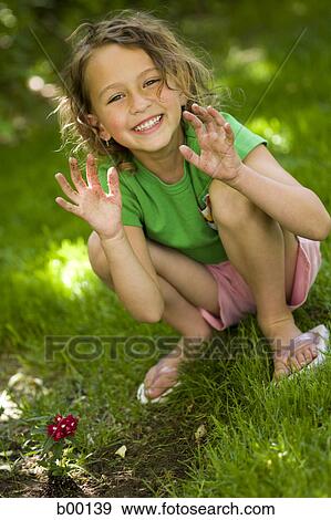 Stock Photo - Portrait of a girl smiling. Fotosearch