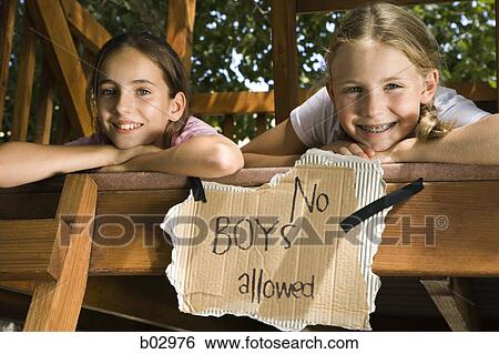 Portrait of two girls on a tree house View Large Photo Image Stock Photograph - Portrait of two girls on a tree house. Fotosearch