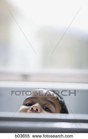 Stock Photography - Low angle view of a young man jumping. Fotosearch