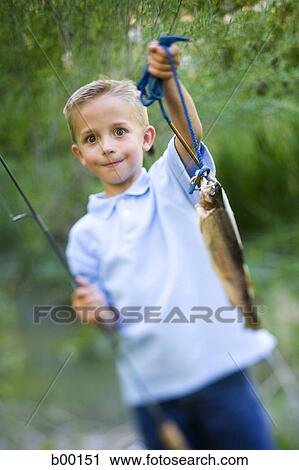 Portrait of a girl holding a fish View Large Photo Image Stock Image - Portrait of a girl holding a fish. Fotosearch