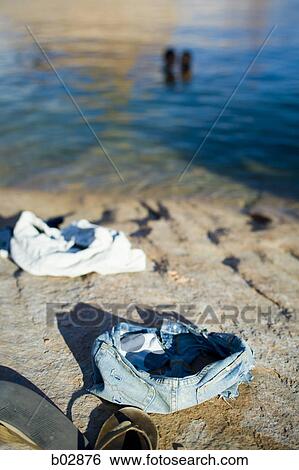A couple skinny-dipping, in the background View Large Photo Image Stock Photograph - A couple skinny-dipping, in the background. Fotosearch