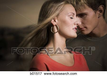 Close-up of a teenage couple with their eyes closed View Large Photo Image Stock Photo - Close-up of a teenage couple with their eyes closed. Fotosearch