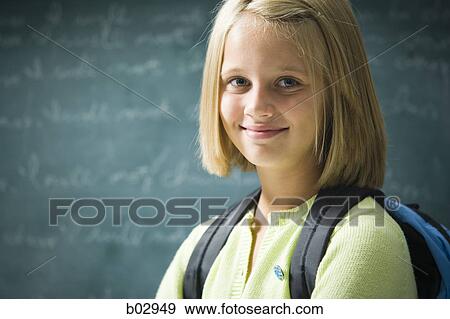 A young girl happy at school View Large Photo Image Stock Photo - A young girl happy at school. Fotosearch