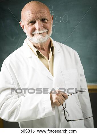 Portrait of a male scientist holding his eyeglasses View Large Photo Image Stock Photography - Portrait of a male scientist holding his eyeglasses. Fotosearch