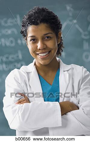 Portrait of a young woman smiling View Large Photo Image Stock Photograph - Portrait of a young woman smiling. Fotosearch
