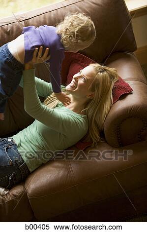 Stock Photography - High angle view of a mother lifting up her daughter. Fotosearch