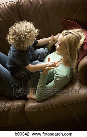 High angle view of a mother playing with her son View Large Photo Image Stock Image - High angle view of a mother playing with her son. Fotosearch