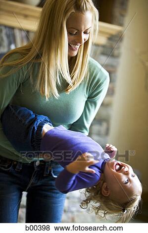 Mother playing with her daughter View Large Photo Image Stock Photo - Mother playing with her daughter. Fotosearch