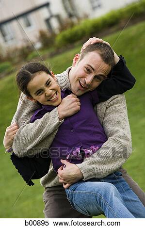 Portrait of a father hugging his daughter View Large Photo Image Stock Photography - Portrait of a father hugging his daughter. Fotosearch