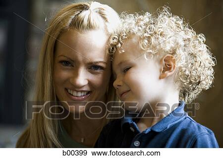 Stock Photo - Portrait of a mother and her son smiling. Fotosearch