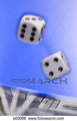 Close-up of a pair of dice above US currency View Large Photo Image Stock Photograph - Close-up of a pair of dice above US currency. Fotosearch