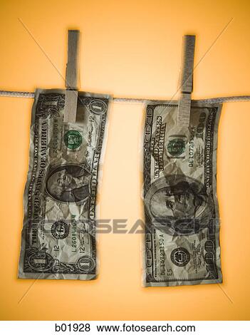 Close-up of money hanging on a clothes line View Large Photo Image Stock Photo - Close-up of money hanging on a clothes line. Fotosearch
