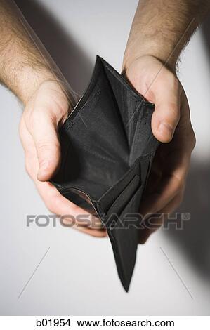 High angle view of hands opening an empty wallet View Large Photo Image Picture - High angle view of hands opening an empty wallet. Fotosearch