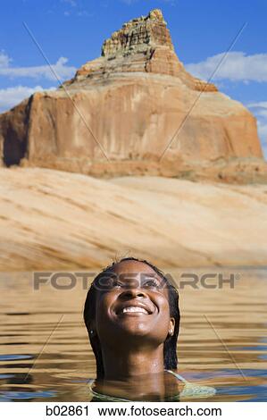 Close-up of a young woman in water View Large Photo Image Stock Image - Close-up of a young woman in water. Fotosearch