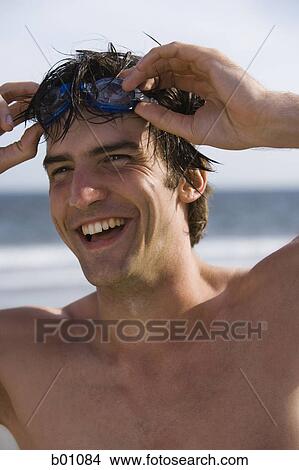 Portrait of a young man on the beach View Large Photo Image Picture - Portrait of a young man on the beach. Fotosearch